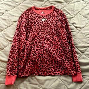 A dark pink leopard print Nike long sleeve t-shirt